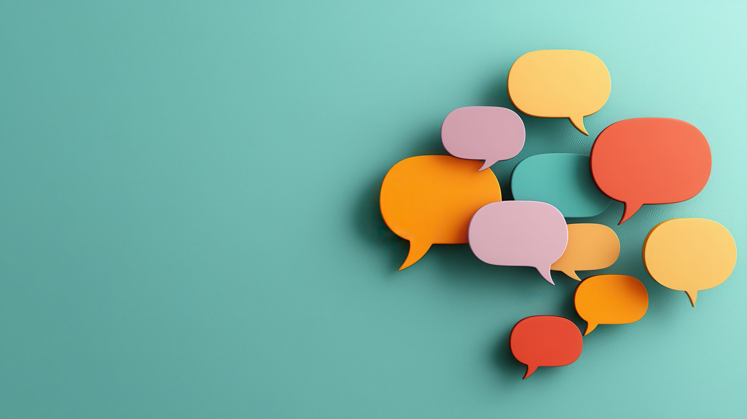 colorful speech bubbles of various shapes and sizes against a bright minimalist background representing modern digital interaction
